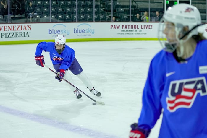 Britta Curl (17) moves the puck as she practices with Team USA at Mullett Arena in Tempe on Nov. 6, 2023.